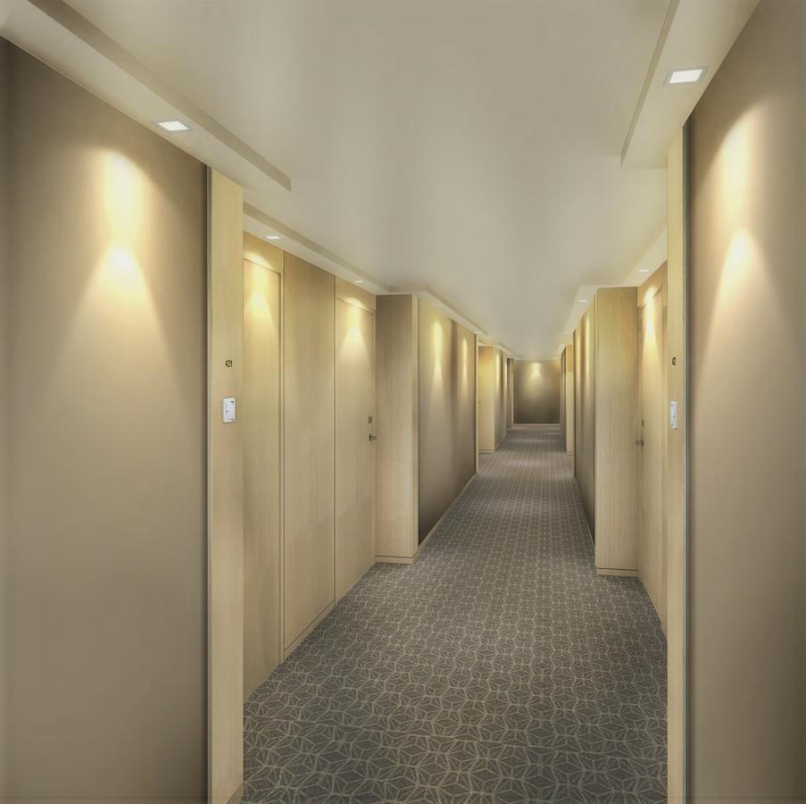 Seda Vertis North Quezon City Esterno foto A typical hotel corridor